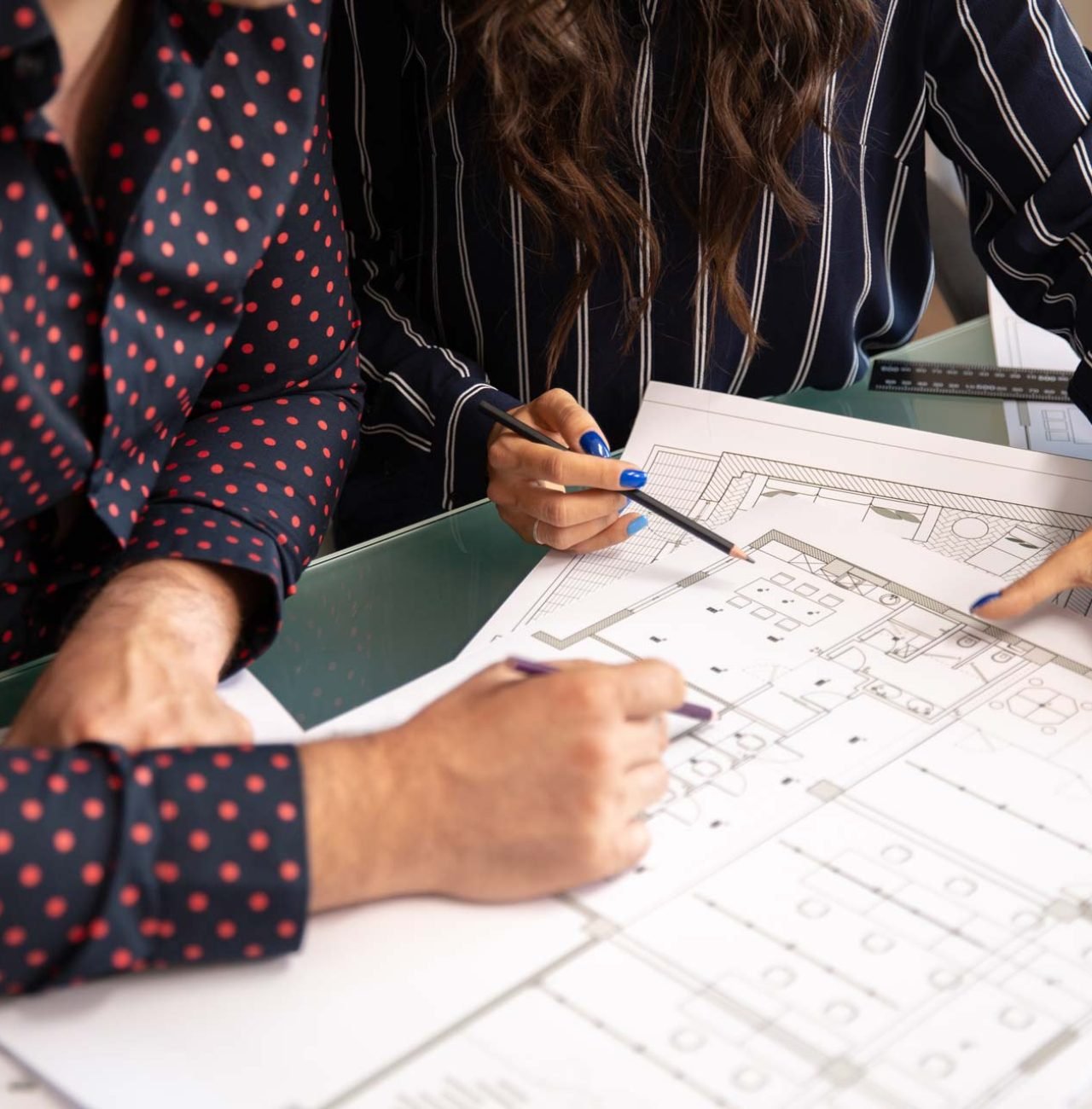 close-up-with-the-hands-of-two-architects-discussi-GMYFTKG.jpg